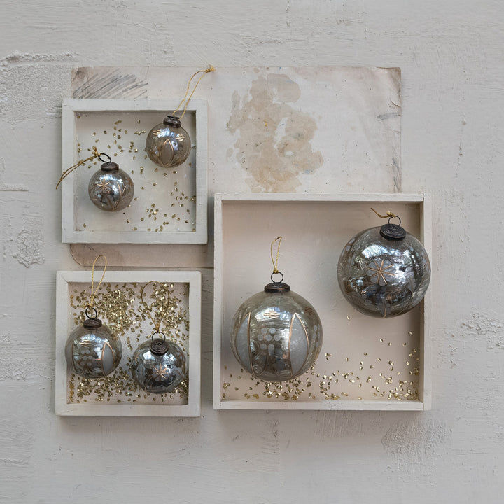 Five etched mercury glass ball ornaments with star and dot patterns, available in two styles.