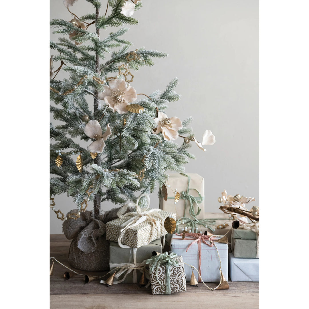 Blush faux magnolia flower garland with glitter and jewels.
