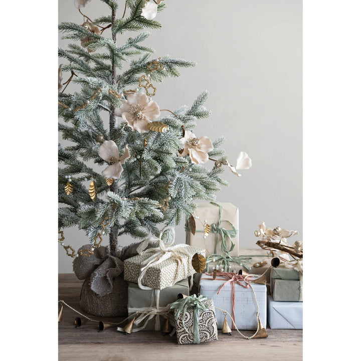 Blush faux magnolia flower garland with glitter and jewels.