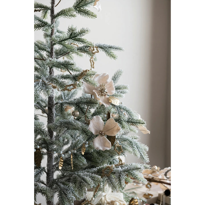 Blush faux magnolia flower garland with glitter and jewels.