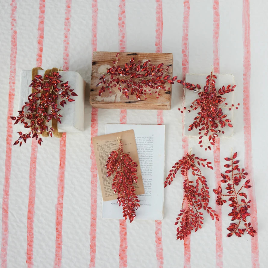 Six red acrylic and wire jeweled ornaments in 6 styles with red faceted stones.
