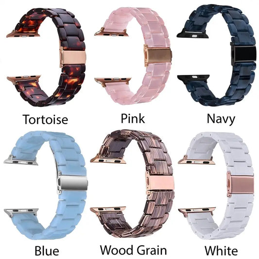Six resin Apple Watch bands in tortoise, pink, navy, blue, wood grain, and white with rose gold clasps. Sizes: 38/40/41mm, 42/44/45mm.