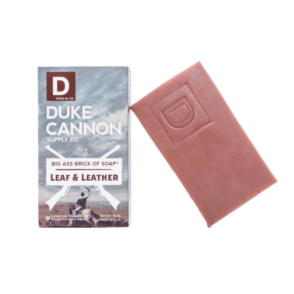 The product is a large brown Big Ass Brick of Soap in Leaf and Leather variant. Comes with branded packaging featuring a unique military tank design.