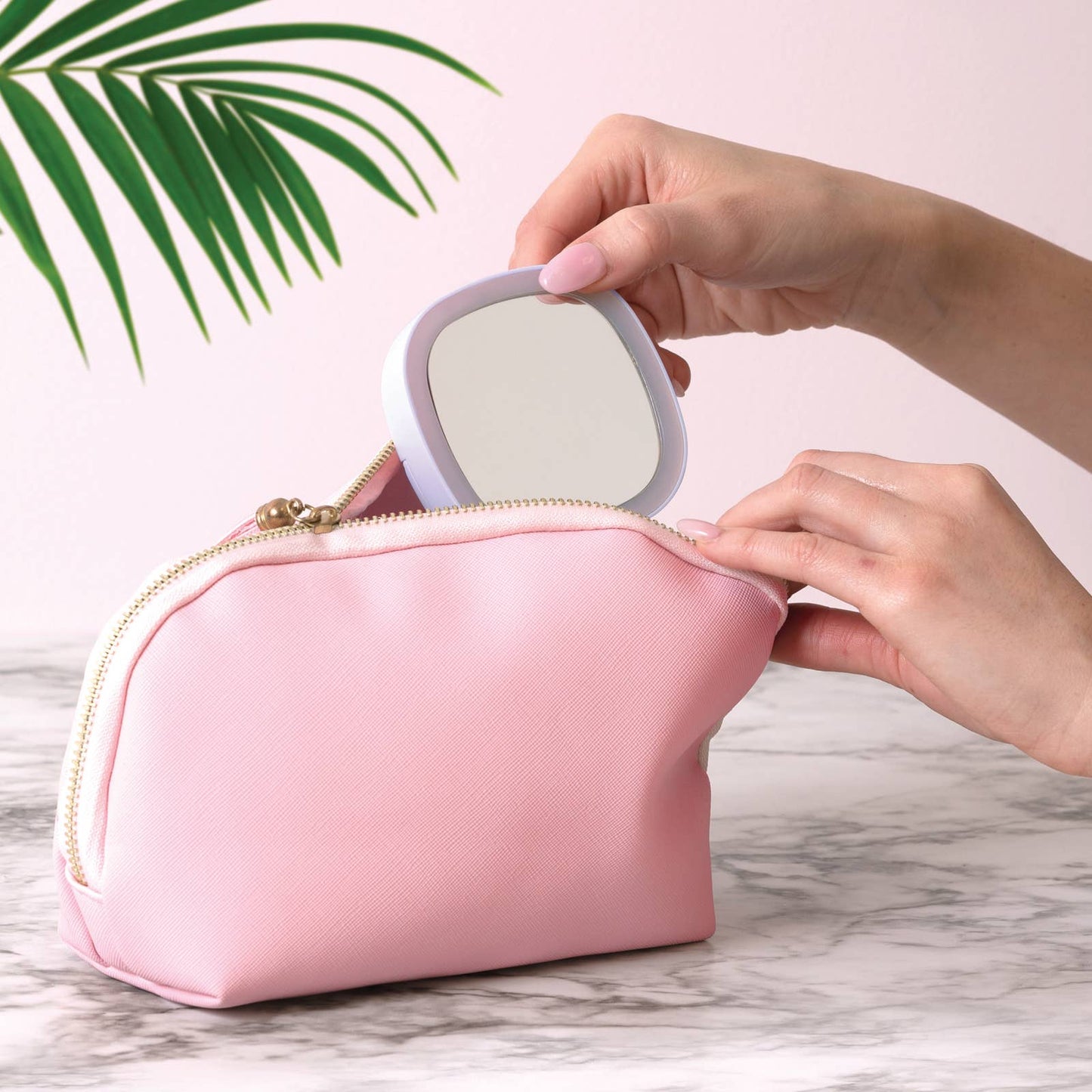 The product is a Lemon Lavender LED Light Up Mini Mirror. Portable and compact, it fits easily into a cosmetic bag. It illuminates with an LED light for better visibility and precision. It features a fresh lemon lavender color that adds elegance to convenience. Available in one standard size perfect for individual use or as travel essential.