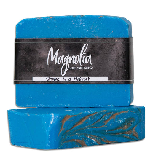 This product features two bars of handmade soap stacked on top of each other. The soap is uniquely colored in blue with captivating swirl designs embedded within. Each bar is labeled "Barber Shave Soap." Available in standard sizes for typical soap bars.