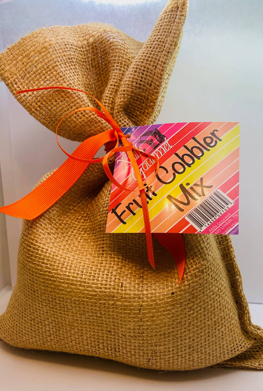 Burlap sack with orange ribbon, "Fruit Cobbler Mix Case" label, dessert mix, barcode. Available sizes: small, medium, large.