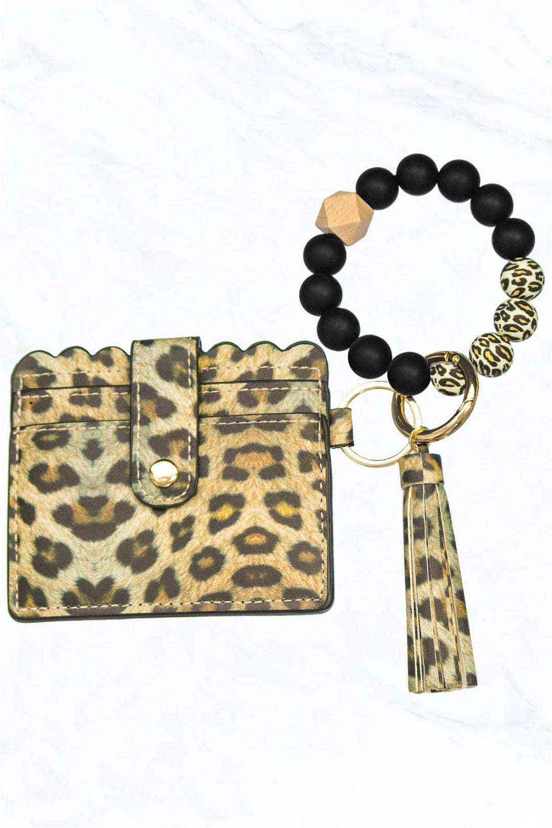 Black and leopard silicone bead bracelet with tassel, scalloped-edge leopard card holder, button closure. Sizes: S, M, L.