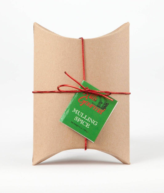 Small, pillow-shaped kraft paper box with red string and green tag; available in one compact size.