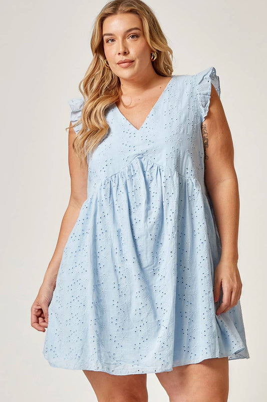 White Eyelet Babydoll Dress with v-neckline and ruffled shoulders. Available in sizes XS–XL.