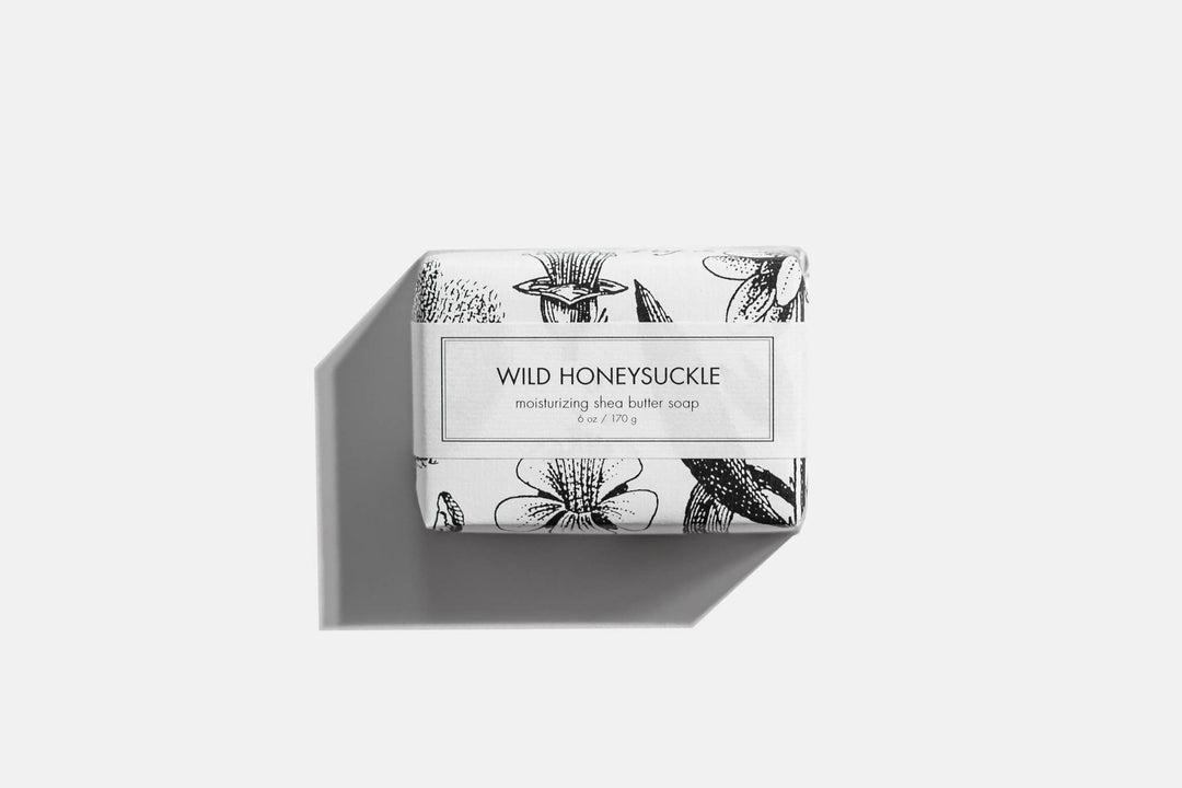 Wild Honeysuckle Soap - Bath Bar. Wrapped in botanical-themed paper. Provides a pleasant floral aroma. Evenly produces lather for ideal cleanliness. Available in standard bar size for convenience and portability.