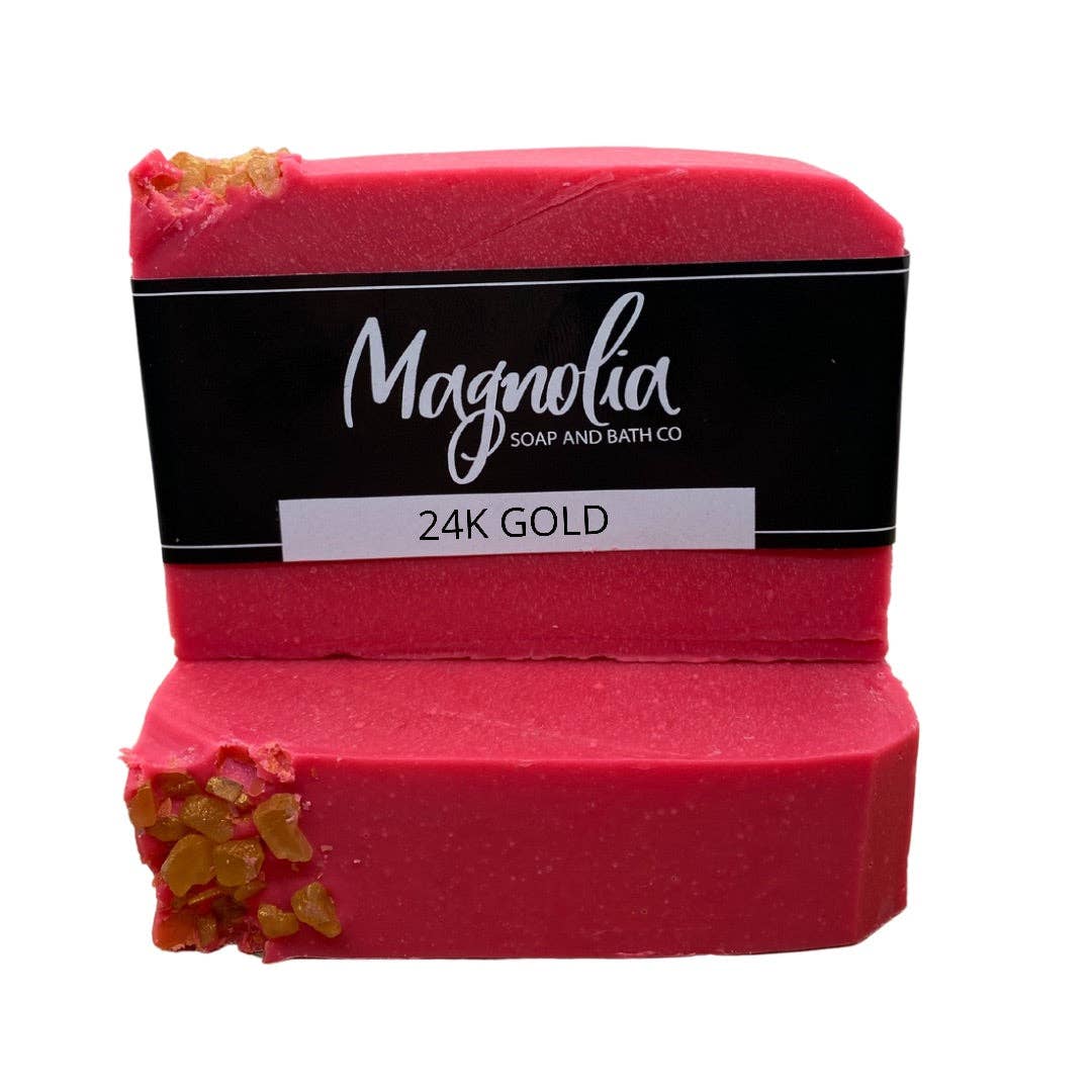 This is a bar soap from Magnolia Soap and Bath Co, named the 24K Gold soap. The product features an eye-catching vibrant red hue with a partial top layer embedded with real gold flakes for an opulent effect. Scented with sparkling quince, it adds a delightful aroma to your bathing experience. Set comprises of one bar per item purchase. Check availability for various sizes.