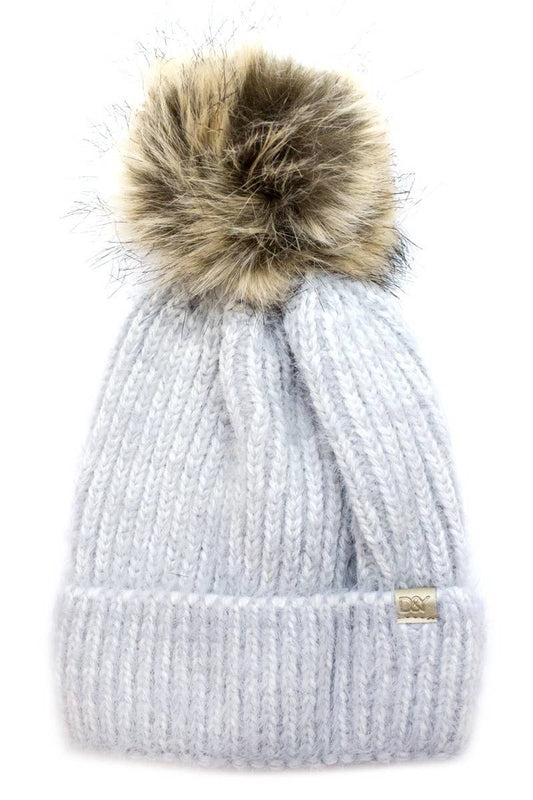Light gray knit beanie with folded brim, large faux fur pom-pom, silver tag; available in S/M and M/L.
