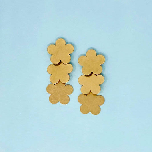 Yellow, flower-shaped Brush Gold May Earrings. Available in small and large sizes.