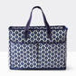 Blue and white patterned tote with two short handles, two front pockets, recycled material. Available in large size.