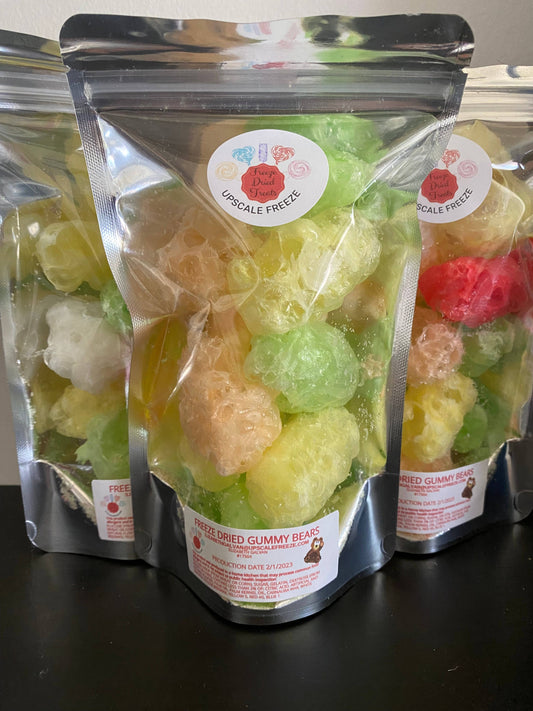Three clear resealable bags of colorful freeze dried gummy bears, labeled “Upscale Freeze.” Sizes: not specified.
