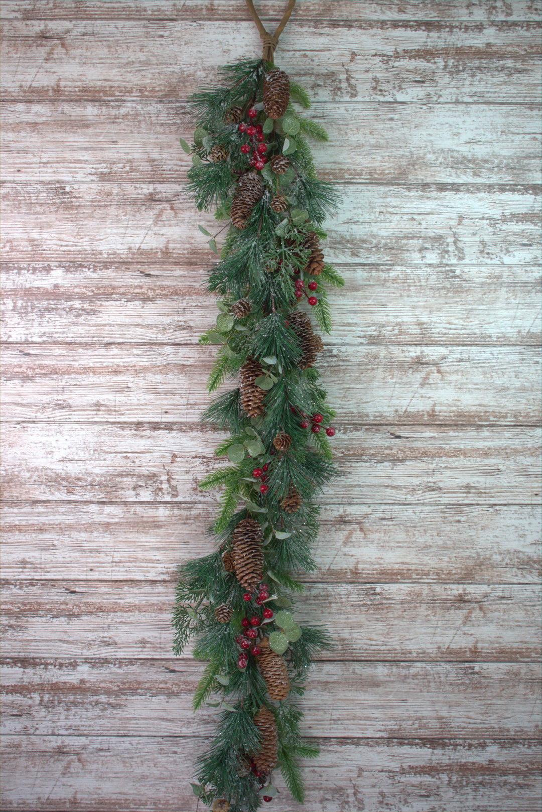 4ft Red Icy Berry &amp; Pine Garland with pine needles, pinecones, and red icy berries.