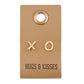 XO-shaped gold stud earrings on leather tag, style F3900. "HUGS & KISSES" printed. Sizes available: S, M, L.