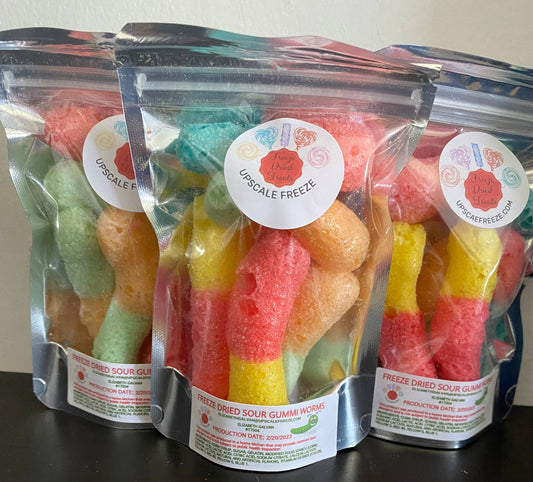 Three clear resealable bags of FREEZE DRIED SOUR WORMS, labeled “Pretty Dope Sweets: Upscale Freeze.” Sizes not shown.