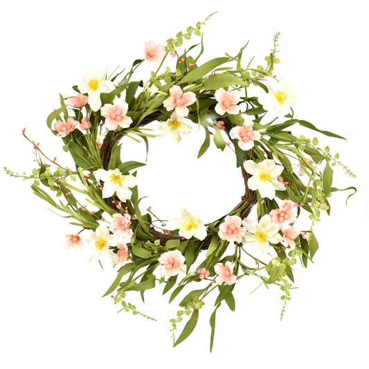 This 22" Clematis Wreath is a vibrant display of pink and white flowers. Complete with green leaves and stems, the arrangement forms an intricate pattern against a contrasting white background.