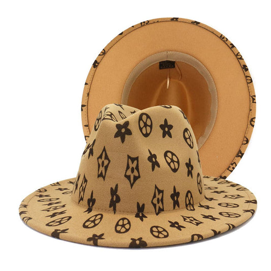 Tan flat brim jazz hat with brown monogram pattern, available in S, M, L. Wide brim and interior details visible.