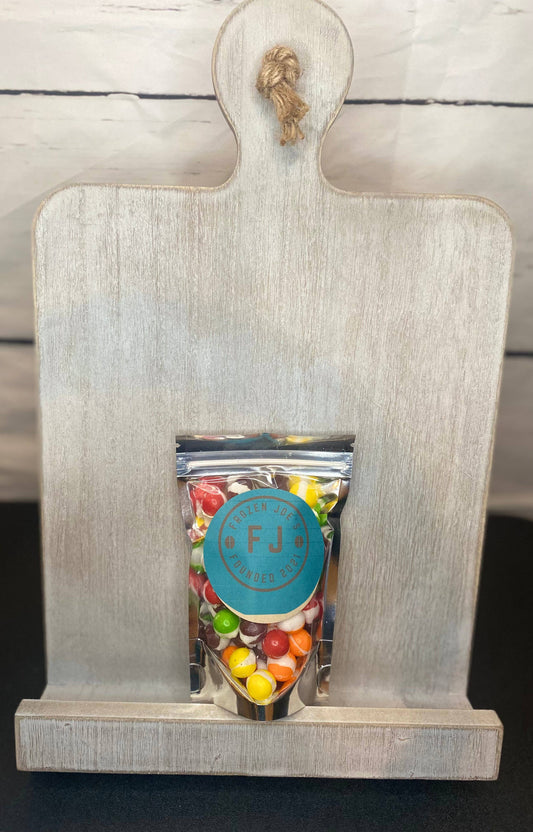 Small bag of freeze dried Skittles with turquoise “FJ” label; size: Small.