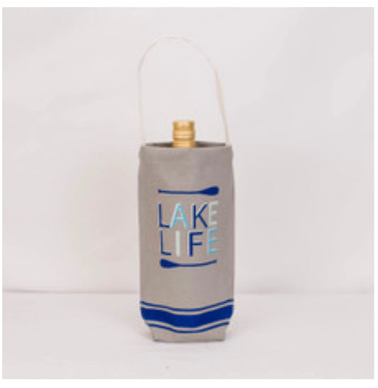 Beige canvas wine bag with handle, gray and blue paddles, "Lake Life" on front. Fits one bottle. Available in one size.