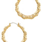 These Bamboo Style Hoop Earrings are intricately designed with distinct segments. The earrings are crafted from durable material and have a size of 50mm. Perfect for adding an elegant touch to any outfit, these earrings flaunt a natural bamboo motif for a unique style statement. They secure comfortably with latch backs for worry-free wear.