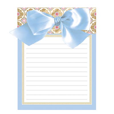 This product is a decorative Acanthus Bow Pad, distinguished by its large light blue bow and ornamental golden floral patterns around the edges. It offers a lined blank space for writing in the center with perforated sheets. Available in one size.