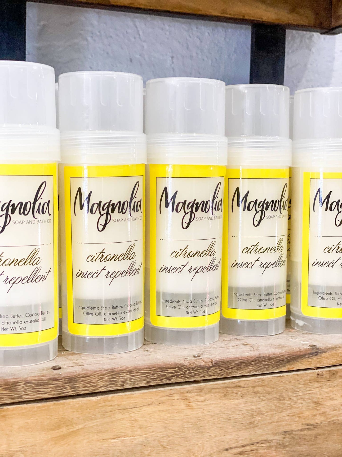 The BUG AWAY Lotion Bar repellent sticks are a product of Magnolia. The products come with yellow and white labels, featuring information on the ingredients, essential oil content, and net weight. They serve as effective bug repellents offered in lotion bar form. Sizes for each stick available are not specified.