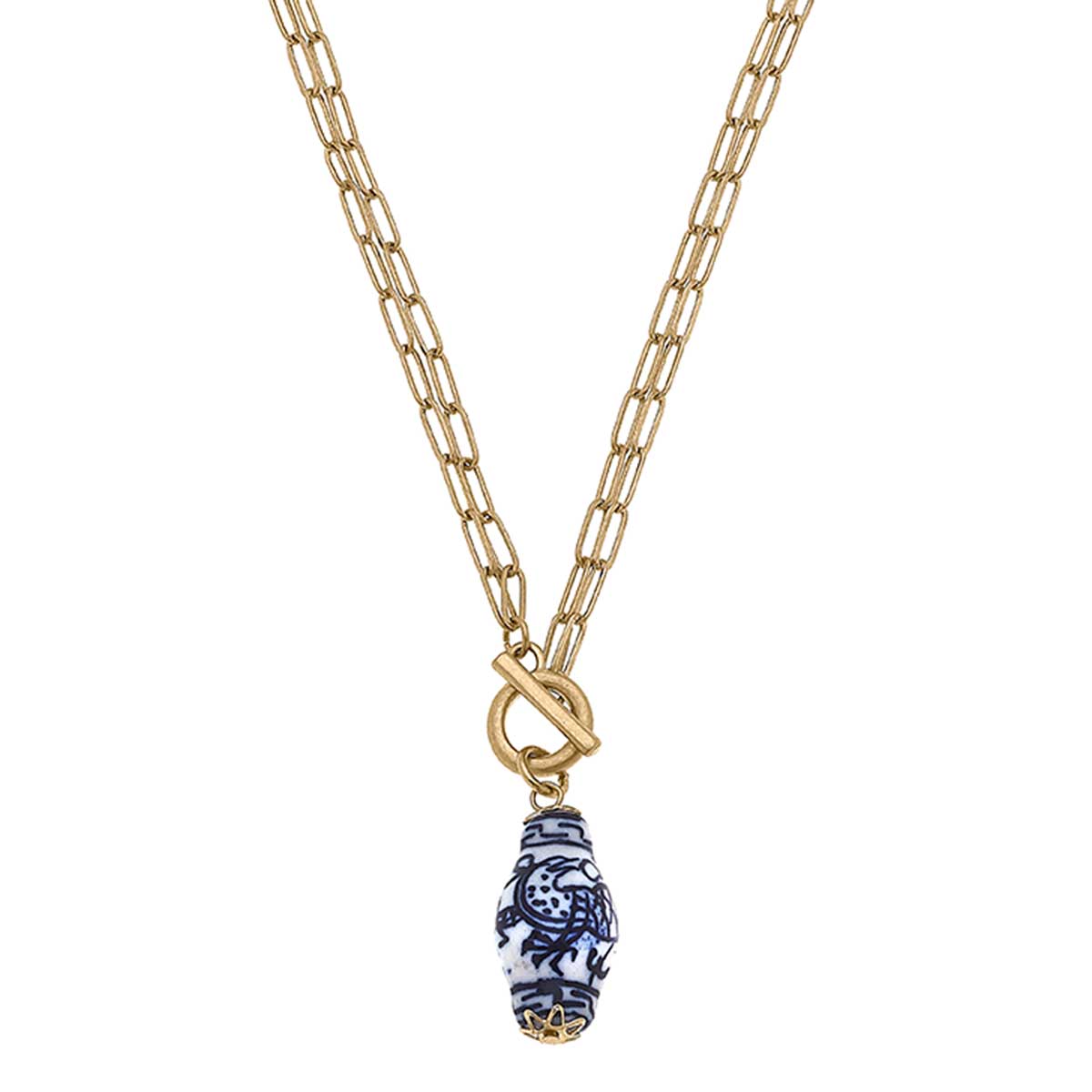 T-Bar Necklace with a blue and white chinoiserie design on a porcelain pendant. The pendant showcases a traditional floral pattern. It hangs from a circular clasp attached to the chain necklace. Available in one standard size.