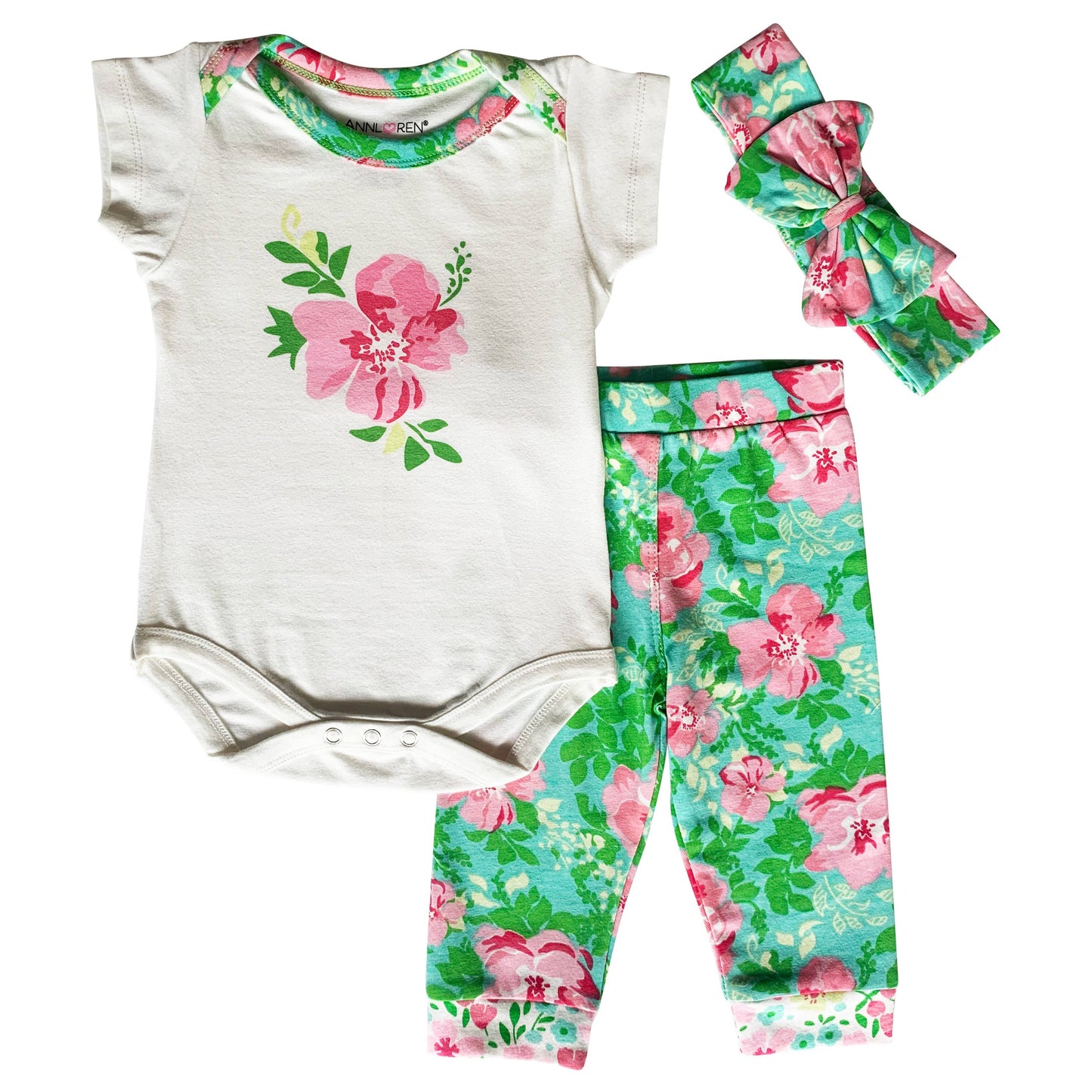 Short sleeve onesie, bow headband, and pants set with white onesie with pink flower design, green pants with floral design, and green headband with floral design.