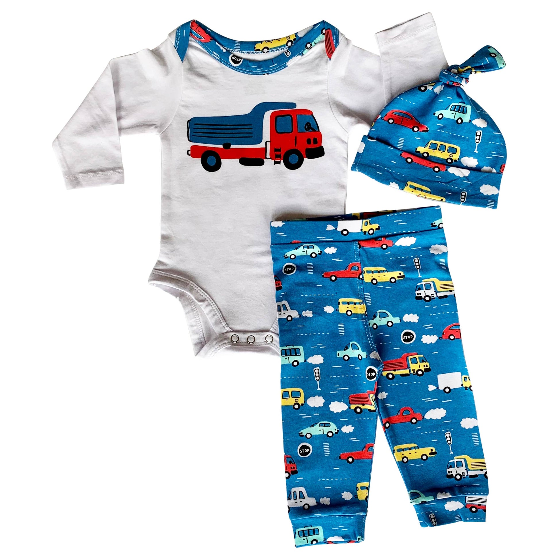 Three piece set - onesie, hat, and pants- patterned with cars & truck with blue accents. Onesie is long sleeved and hat has knot in it.