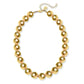 24Kt gold-plated ball choker with large beads, adjustable chain, clasp, and oval tag. Available in S, M, L.