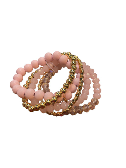 The Mandy Bracelet: set of four blush and gold bead bracelets with round beads and faceted crystals. Sizes: S, M, L.