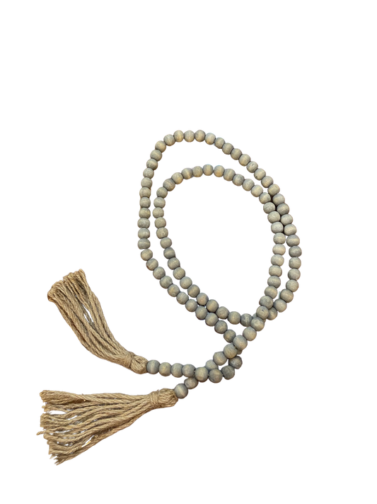 Wood Bead Garland with two tan tassels. Available sizes: 24", 36", and 48".