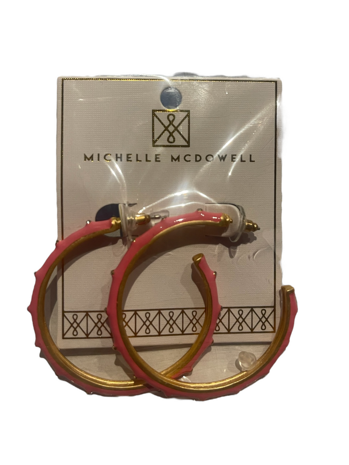 Pink and gold textured hoop earrings. Available sizes: small, medium, large.
