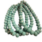 Glass beaded strand bracelet with round, faceted turquoise beads. Available sizes: S, M, L.