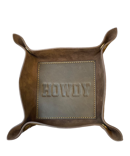 Brown leather valet tray with raised corners, brass rivets, "HOWDY" embossing. Available in small and large sizes.
