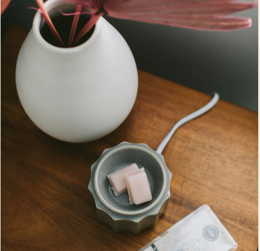 Grey wax warmer with two Sweet Grace Wax Bars, available in multiple sizes, provides flameless fragrance.