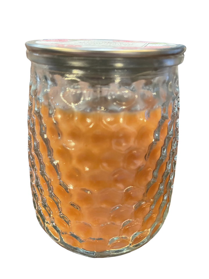 Textured glass jar with orange Peony Bloom Candle wax (13 oz) from Greenleaf Fragrances, sealed with metal lid.