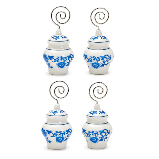 Set of four small white ceramic ginger jar placement holders with blue floral designs and silver spirals. Sizes: Small, Medium.