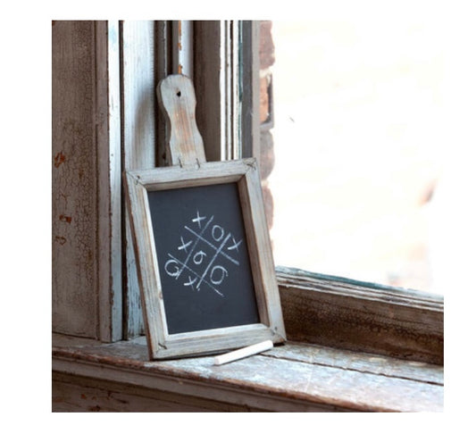 The Paddle Blackboard is a small framed chalkboard with a tic-tac-toe game in white chalk. Available in small and medium sizes.