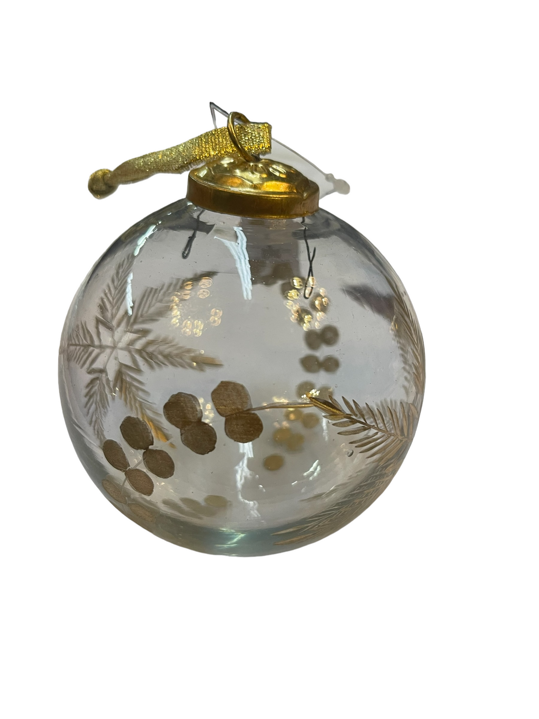 Clear glass ornament with gold leaf-and-berry pattern, gold cap, and ribbon.