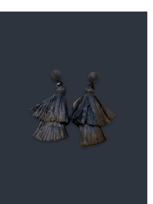 Dark, fan-shaped earrings with round textured studs and layered raffia tassels. Available sizes: small, medium, large.