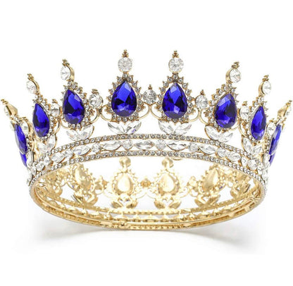 Vintage gold crown with teardrop blue gems, clear crystals, and ornate details. Available in small, medium, and large.
