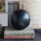 Black spherical object, available in 8cm and 12cm diameter sizes.