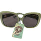 Light green cat-eye Kleo Sunglasses with dark lenses, lion tag, “Rio UV 400 Protection.” Sizes: S, M, L.