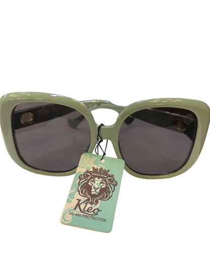 Light green cat-eye Kleo Sunglasses with dark lenses, lion tag, “Rio UV 400 Protection.” Sizes: S, M, L.
