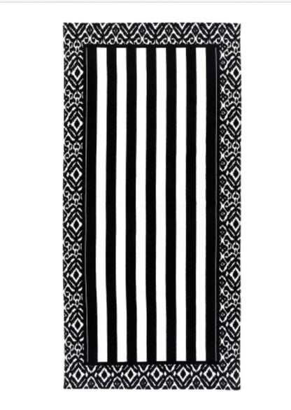 Rectangular cotton beach towel with black and white stripes, wide black geometric border; available in standard and large sizes.