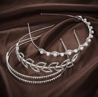 Three Crystal Flowers & Leaves Crown Headbands in silver with pearls and rhinestones. Available in S, M, and L sizes.